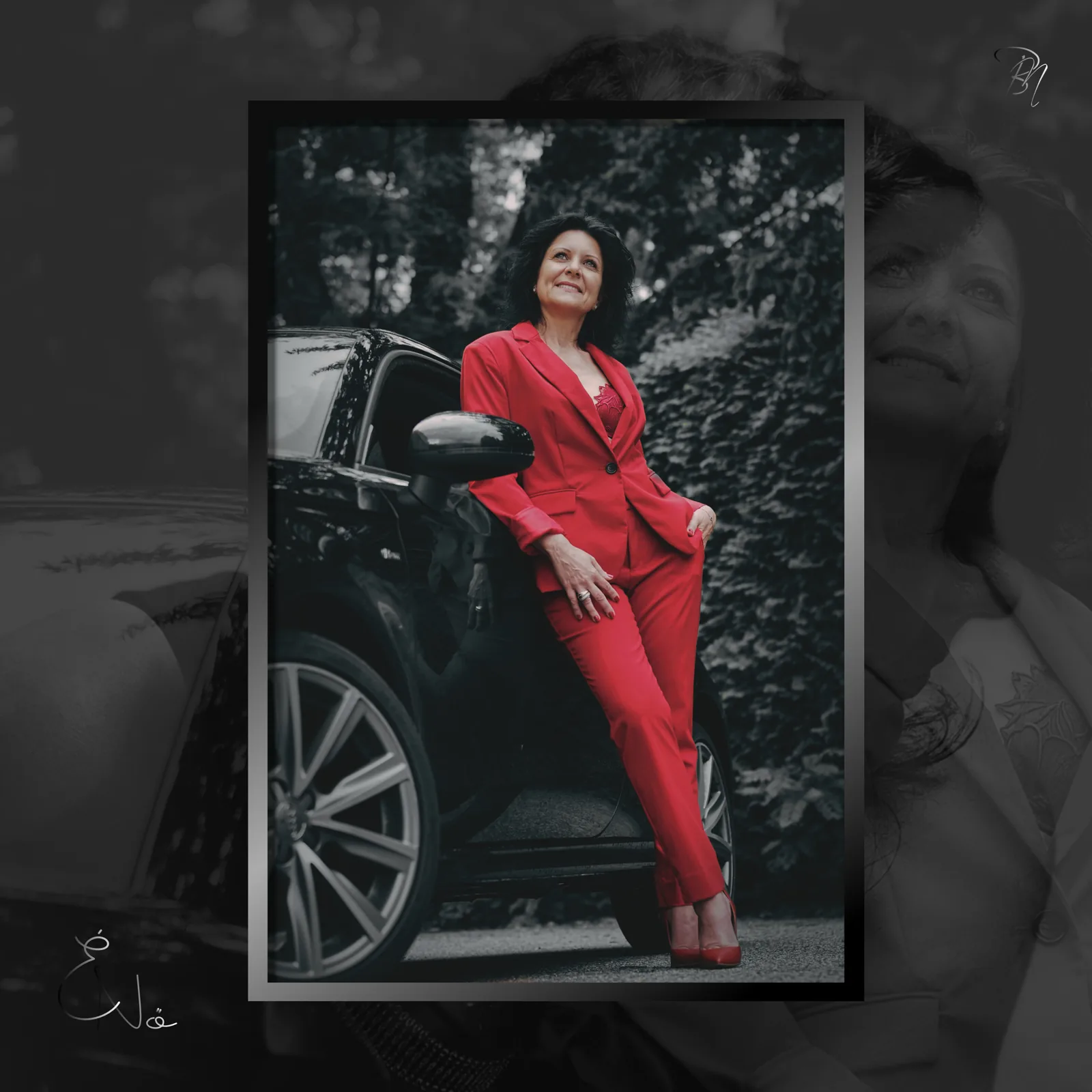 Beside the car — Photo: Norbert Banhalmi A woman in a red suit stands beside a dark car among trees.